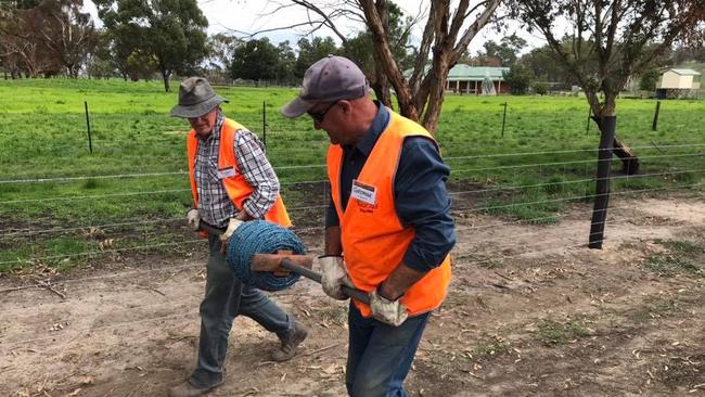 BlazeAid volunteers working on a Hills property following the Cudlee Creek fire. Source. BlazeAid at Lobethal.