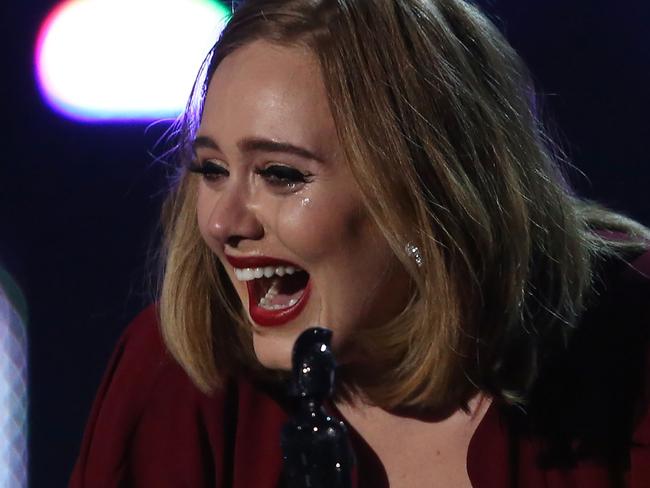 Adele breaks into tears as she accepts her Global Success Award. Picture: AFP/Justin Tallis