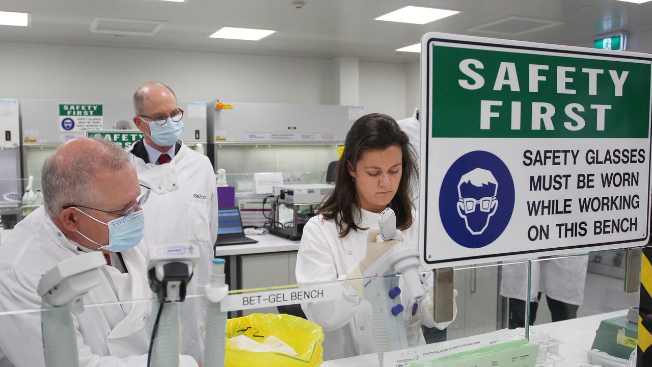 Prime Minister Scott Morrison (left) in the laboratory at AstraZeneca on Wednesday. Picture: Lisa Maree Williams/Getty Images