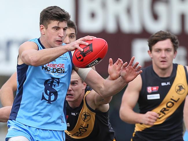 Patrick Wilson (Sturt) about to kick the ball out of the centre of the ground during the second quarter. Glenelg v Sturt, SANFL Football, at Glenelg Oval. 19/06/16 Picture: Stephen Laffer