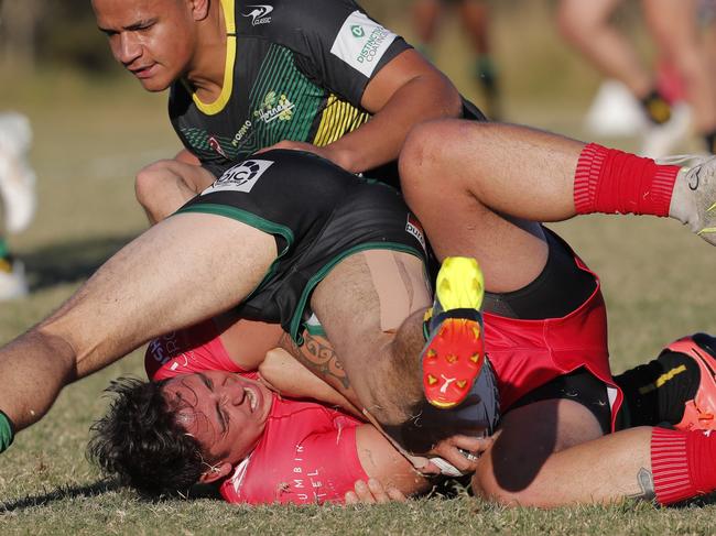 Kalin Ropata of Currumbin Eagles is tackled. Photo: Regi Varghese