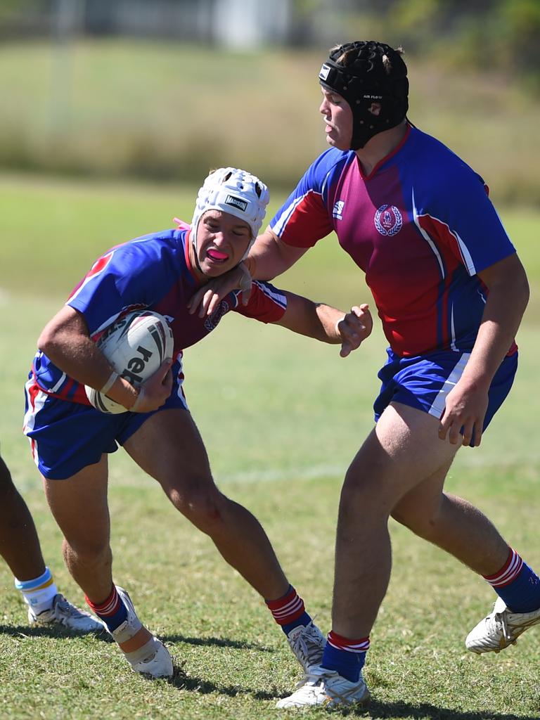 Boys Rugby League State Championship held at Northern Division, Brothers Leagues ground, Townsville. 16-18 years. Peninsula (stripe) v Darling Downs (blue/purple). Braithen Scott of St Mary's College, Toowoomba.