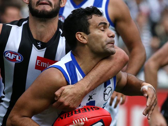 Round 5: Collingwood v North Melbourne Brodie Grundy tackles Lindsay Thomas. AFLR514 Picture:Wayne Ludbey