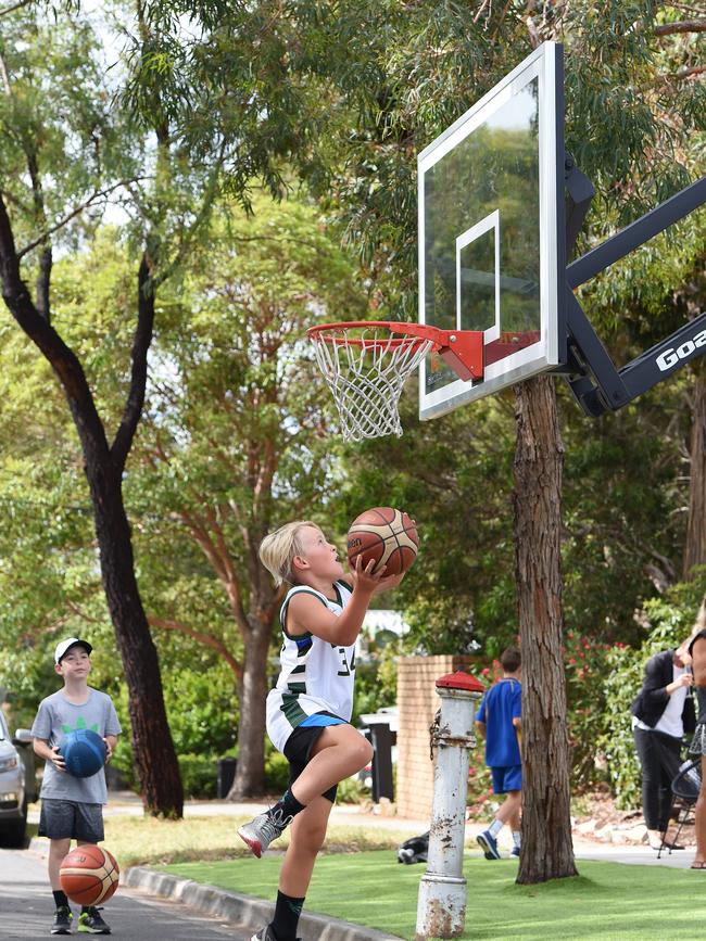 Angus, 9, shoots some hoops. 