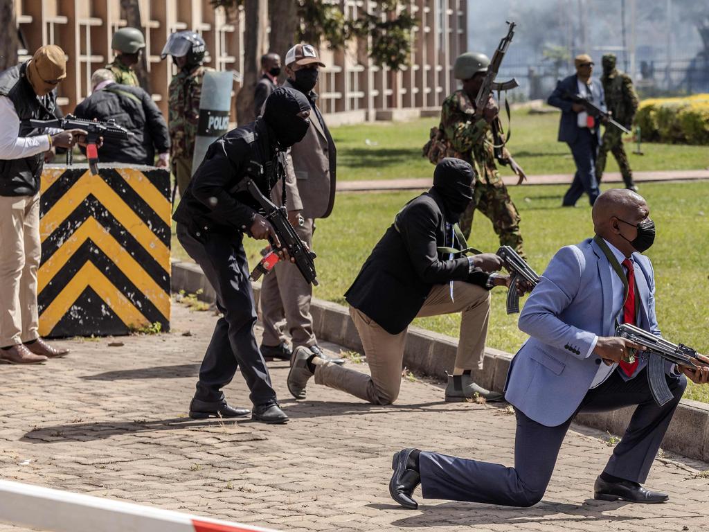 Kenyan Police officers and security personnel take positions to protect the Kenyan Parliament as protesters try to storm the building during a nationwide strike to protest against tax hikes and the Finance Bill 2024, in downtown Nairobi, on June 25, 2024. Picture: AFP