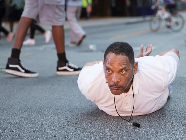 A man lays on the ground after yelling ‘Don't shoot me’ at police during a rally in Dallas, Texas, on Thursday. Picture: AFP PHOTO/Laura Buckman