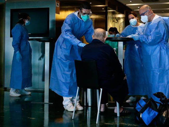 Healthcare workers attend to a COVID-19 patient at a hotel-turned-hospital in Barcelona. Picture: AFP