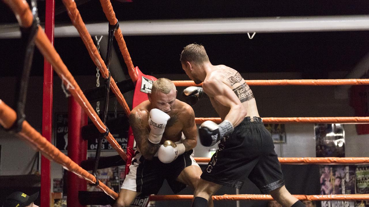 Steve Spark (right) lands a shot on Mick Whitehead as part of the Locked Down Lights Up card at Smithys TGW Gym. Picture: Kevin Farmer