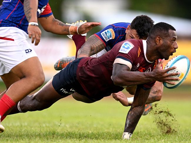 APIA, SAMOA - APRIL 14: Suliasi Vunivalu of the Reds offloads the ball during the round eight Super Rugby Pacific match between Moana Pasifika and Queensland Reds at Apia Park National Stadium, on April 14, 2023, in Apia, Samoa. (Photo by Joe Allison/Getty Images)