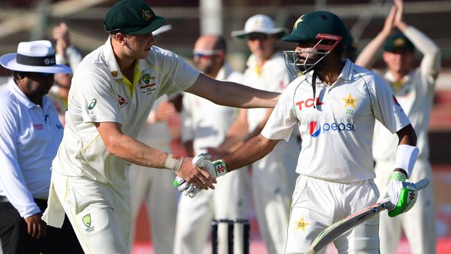 Australia's Cameron Green shakes hands with Babar Azam after dismissal on 196.