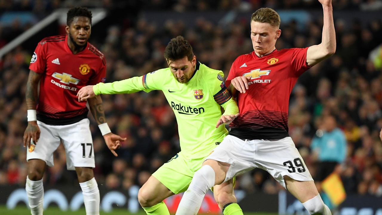 Barcelona's Argentinian forward Lionel Messi (C) vies with Manchester United's English midfielder Scott McTominay