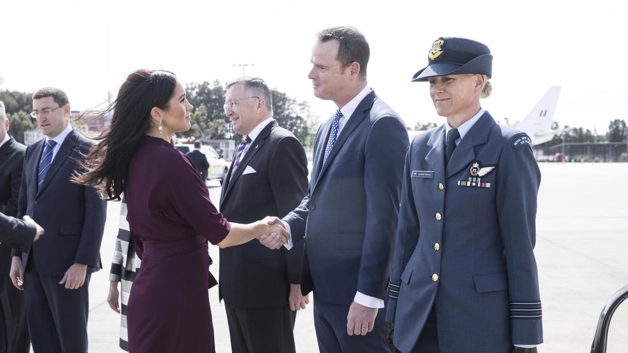 Meghan Markle shakes hands with Mr Paul Singer MVO, Acting official Secretary to t he Governor General before she and Prince Harry board their plane to leave Australia for New Zealand in October 2018. Photo: Jessica Hromas/Fairfax Media