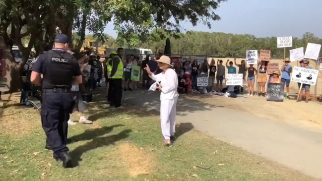 Black swan lake protesters chain themselves to fence