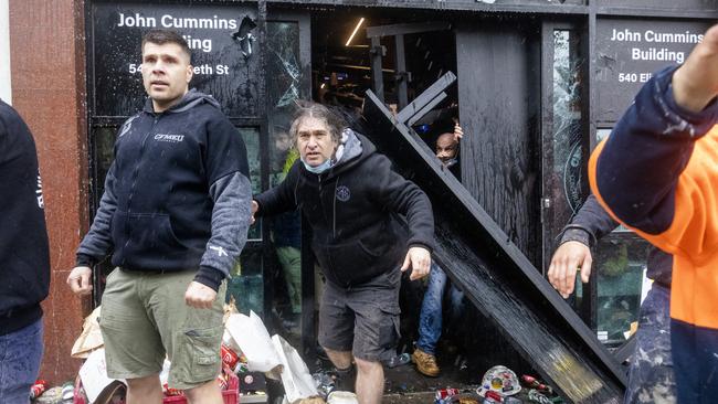 CFMEU members leave the building after the attack. Picture: David Geraghty