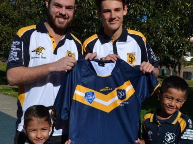 St Patricks JRLC senior club captain Ryan Casey and junior club captain Jayden Campion handing jersey U6 players Thalia Yazbek and Evanda Filipo-Ulugia.