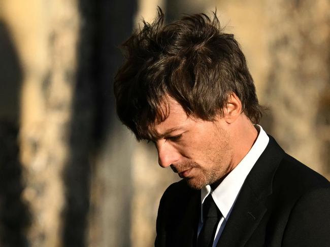 Louis Tomlinson had his eyes downcast as he left. Picture: AFP