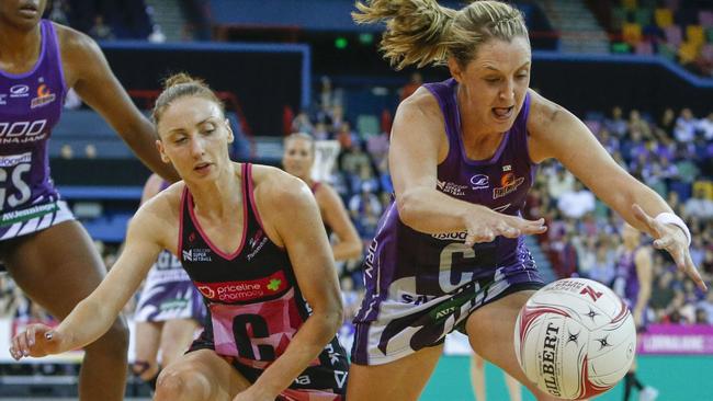 Thunderbird Jade Clarke battles the Firebirds’ Erin Burger. Clarke was later forced off the court with injury. Picture: Glenn Hunt (AAP)