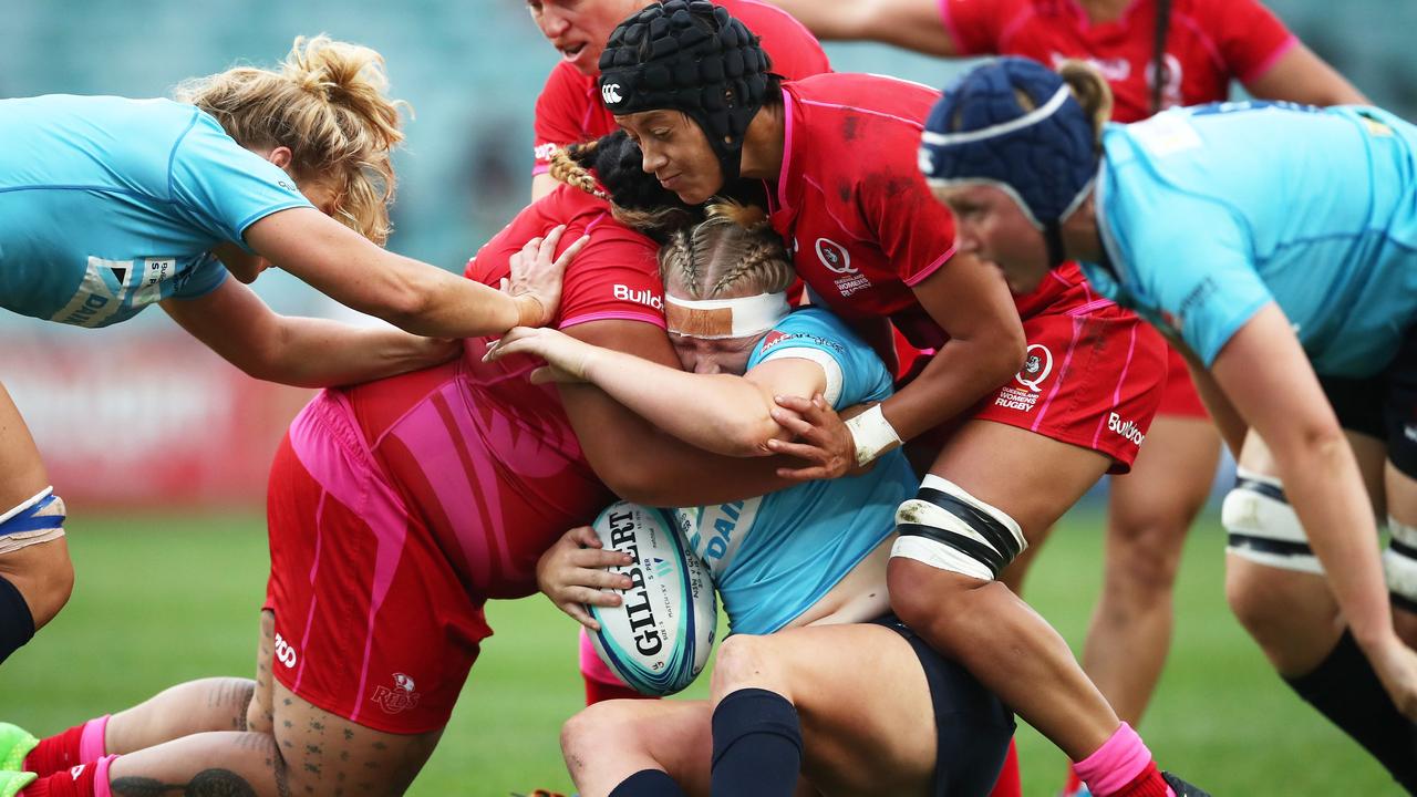 Emily Robinson of New South Wales is tackled during the 2018 Super W final.
