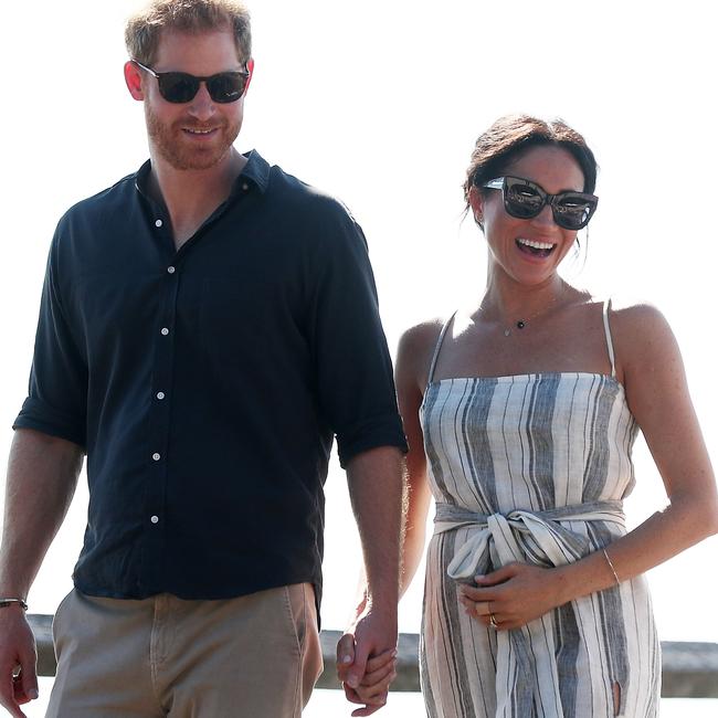 Prince Harry, Duke of Sussex and Meghan, Duchess of Sussex hand-in-hand during their Aussie royal tour in Fraser Island.