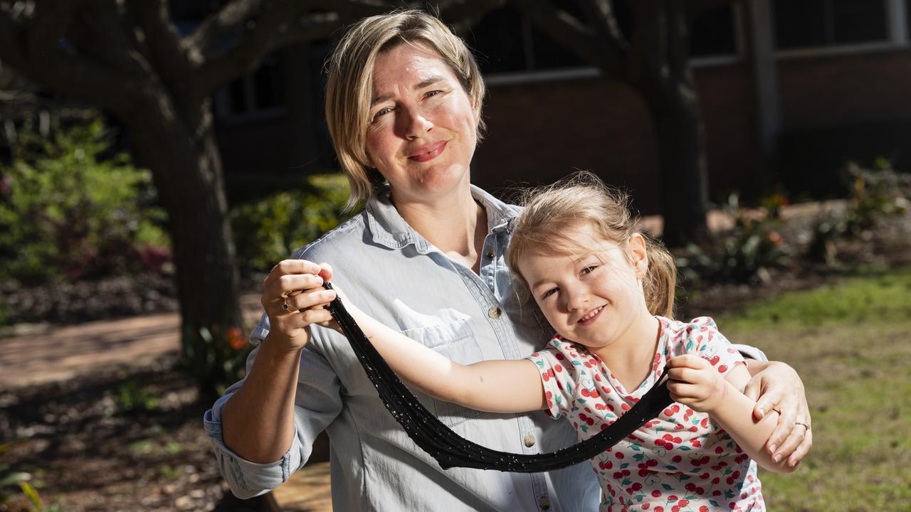 Keeley Henderson and daughter Poppy Henderson-Currey play with space slime Poppy made at iLAuNCH Space family fun day, part of UniSQ's Open Day, Sunday, August 18, 2024. Picture: Kevin Farmer