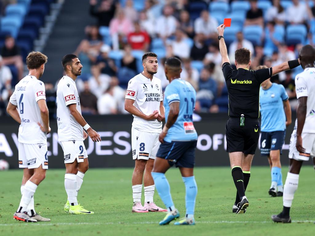 Zinedine Machach of the Victory is shown a red card from Referee Adam Kersey during the round 10 A-League Men match between Sydney FC and Melbourne Victory at Allianz Stadium, on December 28, 2024, in Sydney, Australia. (Photo by Brendon Thorne/Getty Images)