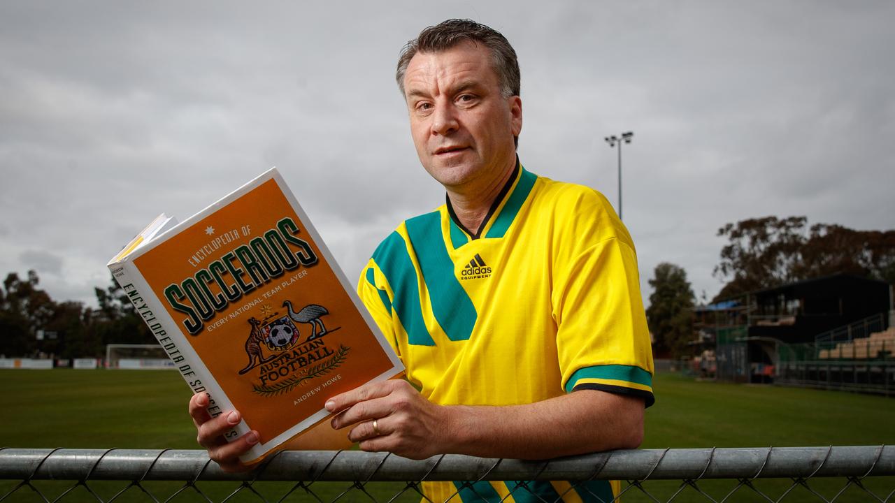 Andrew Howe with his Encyclopedia of Socceroos.