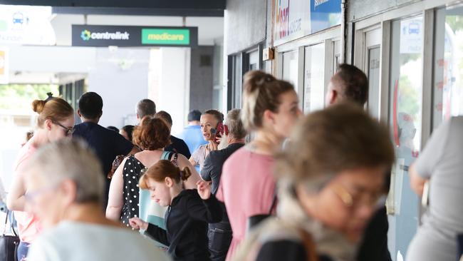 People queue outside Centrelink in Nundah, Brisbane. Picture: Claudia Baxter/AAP Image