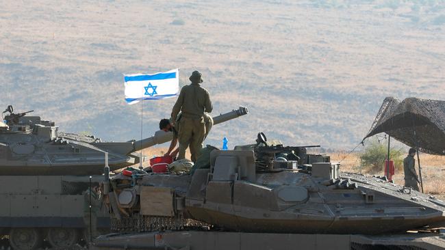 Tanks amassed in Israel near the border with Lebanon early in the war effort. Picture: AFP