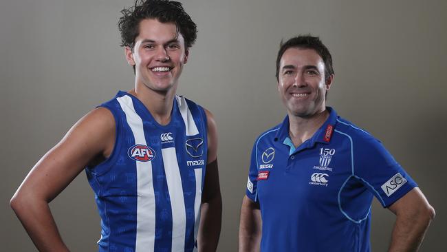 Curtis Taylor, drafted with pick 46, joins the Kangas and coach Brad Scott. Pic: Michael Klein