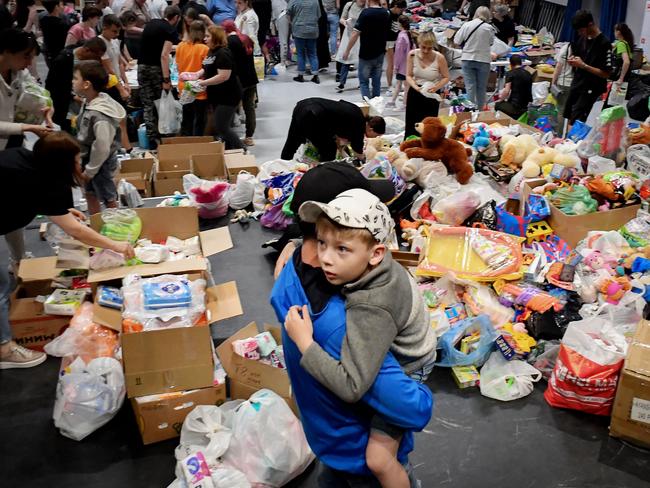 People evacuated from zones bordering Ukraine, including those from the town of Shebekino, receive humanitarian aid in Belgorod. Picture: AFP