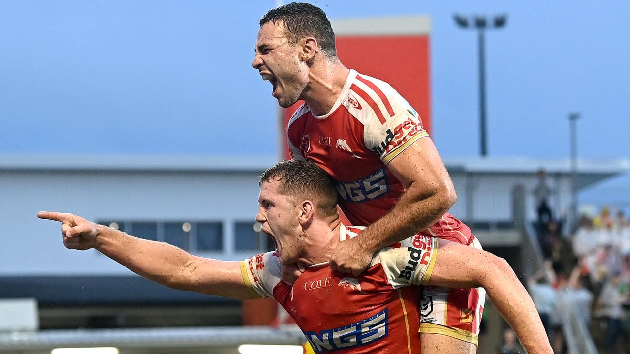 Tom Gilbert of the Dolphins celebrates scoring a try during the round two