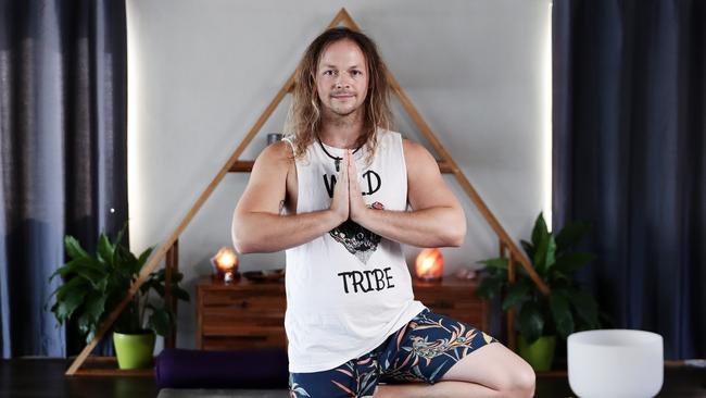 Cairns residents are seeking a happy and healthy start to 2022, approaching the New Year with a healthy mind, body and soul. Co-owner of Wild Heart Yoga Tribe Jay Horton offers a full range of classes every day of the week from his Edge Hill studio, helping people live their healthiest lives. Picture: Brendan Radke