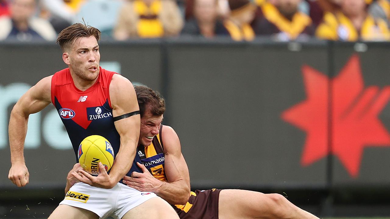 Jack Viney shrugs off a tackle in round five of the 2021 AFL season.