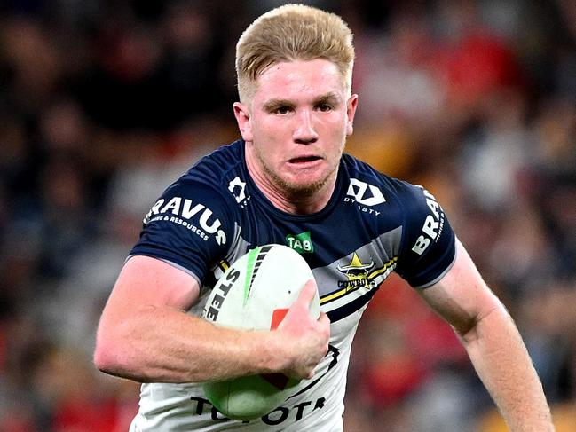 BRISBANE, AUSTRALIA - AUGUST 25: Tom Dearden of the Cowboys breaks away from the defence during the round 26 NRL match between Dolphins and North Queensland Cowboys at Suncorp Stadium on August 25, 2023 in Brisbane, Australia. (Photo by Bradley Kanaris/Getty Images)