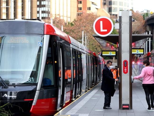 SYDNEY, AUSTRALIA - NewsWire Photos JUNE 23, 2021: Morning commuters pictured getting on the light rail at Circular Quay.Picture: NCA NewsWire / Damian Shaw