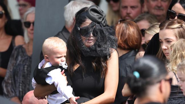 Family and friends gather for the funeral for helicopter pilot Ashley Jenkinson at Southport Church of Christ.Ashley JenkinsonÃs partner Kosha and son Kayden.Picture: NIGEL HALLETT