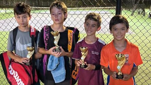 Joshua (right) with other trophy winners after the NSW Closed Country Championship Junior event at Forster.