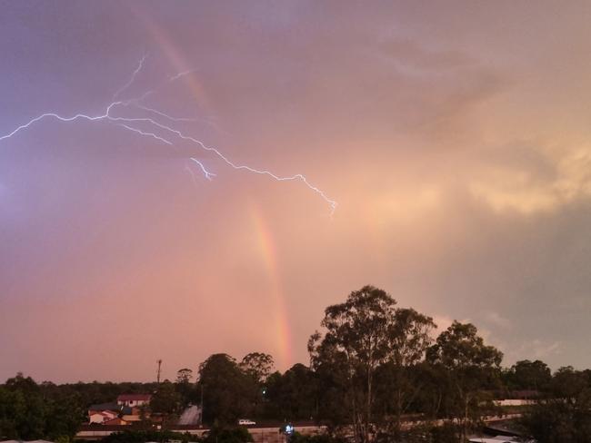 Lightning and rainbows over northwest Brisbane on Tuesday. Picture: Rachel Riley