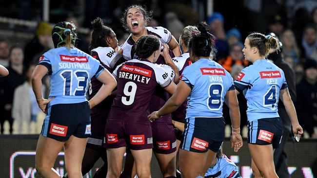 Tazmin Gray of the Maroons (middle) celebrates after scoring a try. Picture: AAP Image