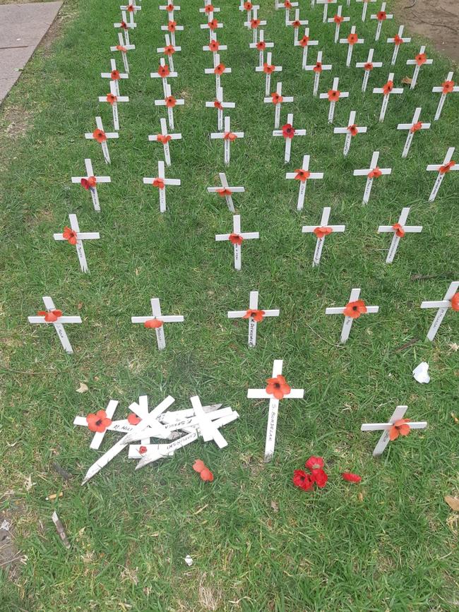 Some of the crosses were pulled out and thrown on the ground.