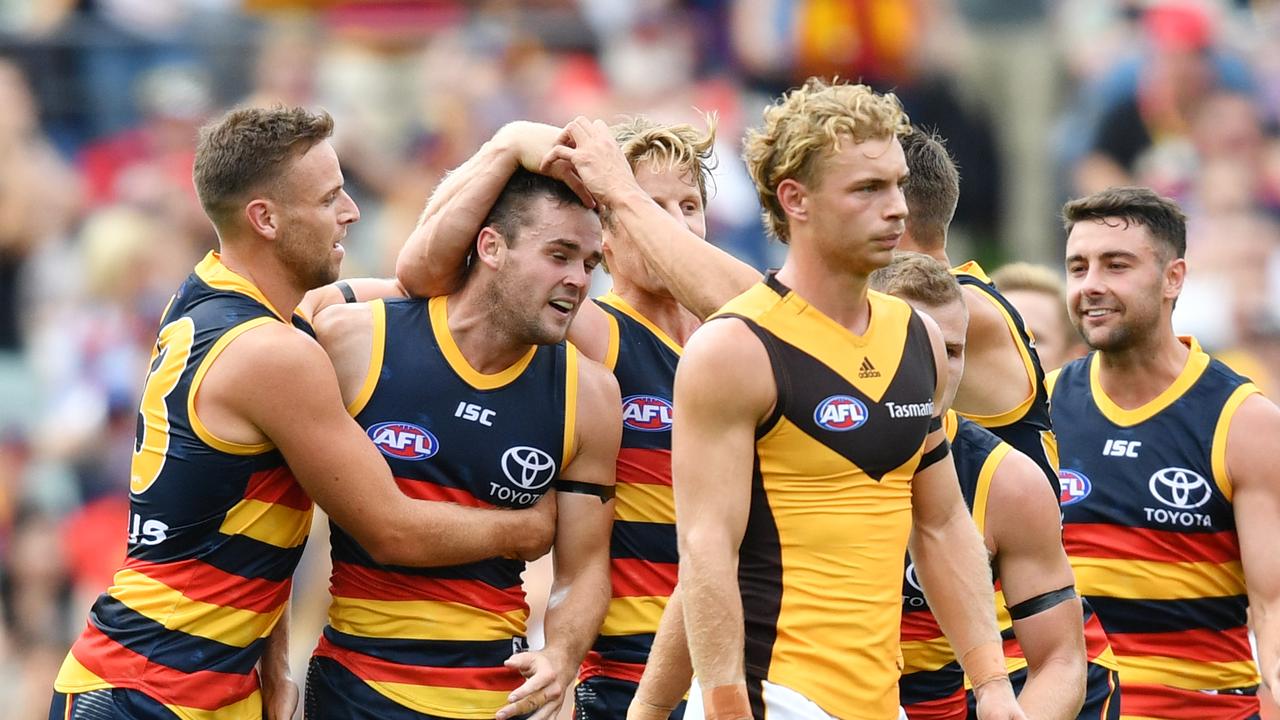 Crows players celebrate a goal by Brad Crouch during his comeback match against Hawthorn after a year on the sidelines. Picture: AAP Image/David Mariuz