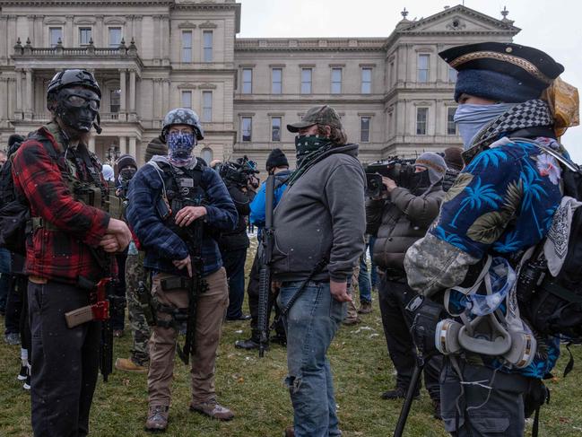 Members of the Michigan Boogaloo Boys, an anti-government group with their long guns near the Capitol Building in Lansing, Michigan. Picture: AFP