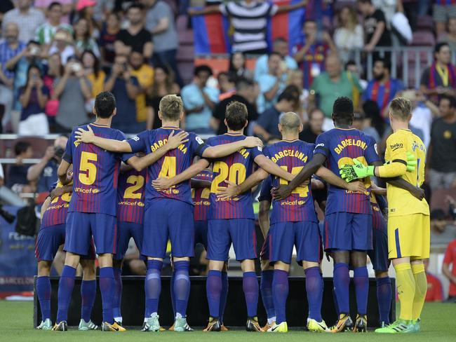 Barcelona's football players pose as they wear jerseys reading "Barcelona" instead of their names to pay tribute to the victims of the Barcelona and Cambrils attacks. Picture: AFP