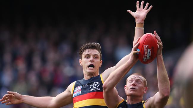 Jake Lever and Sam Jacobs as teammates during last year’s AFL Grand Final. They will meet again as opponents in Alice Springs on Sunday. Picture: Phil Hillyard