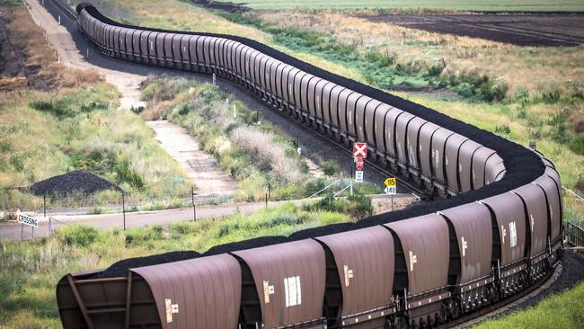 A freight train transports coal from the Gunnedah Coal Handling and Prepararation Plant, operated by Whitehaven Coal Ltd., in Gunnedah, New South Wales, Australia, on Tuesday, Oct. 13, 2020. Prime Minister Scott Morrison warned last month that if power generators don't commit to building 1,000 megawatts of gas-fired generation capacity by April to replace a coal plant set to close in 2023, the pro fossil-fuel government would do so itself. Photographer: David Gray/Bloomberg