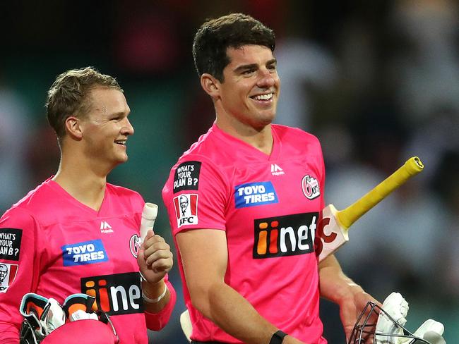 Sixers' Josh Philippe Moises Henriques all smiles after victory during the Big Bash match between the Sydney Sixers and Perth Scorchers at the SCG. Picture. Phil Hillyard