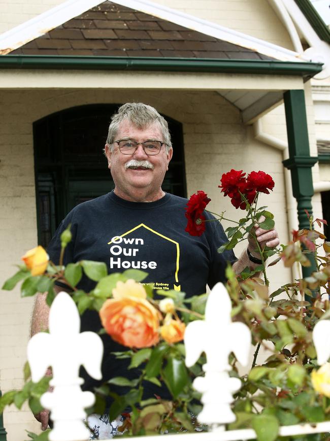 Stephen McAuley with the roses in his garden at his Paddington Home. Picture: John Appleyard