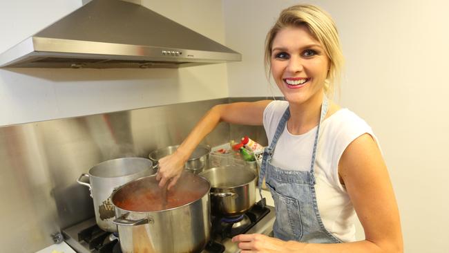 Former MasterChef contestant Courtney Roulston cooking lunch for Sydney Swans players who have their first home game on Saturday. Picture: Bob Barker.