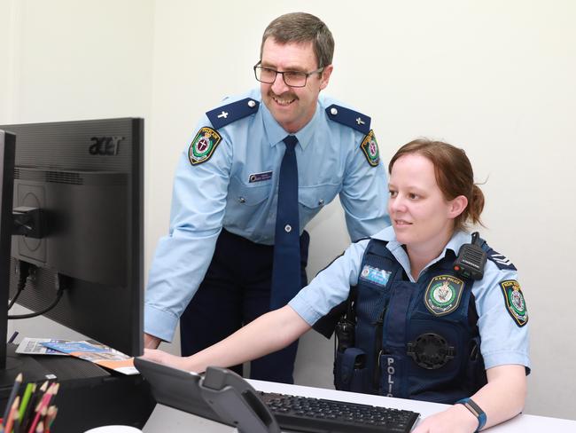 Mr Deutscher with Senior Constable Alison Brown at the Castle Hill station. Picture: AAP Image/Angelo Velardo