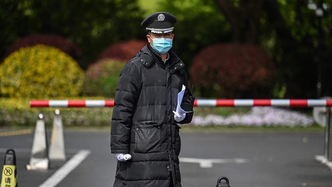 Security on Thursday outside the Shanghai’s Dongjiao State Guest Hotel where John Kerry is staying. Picture: AFP